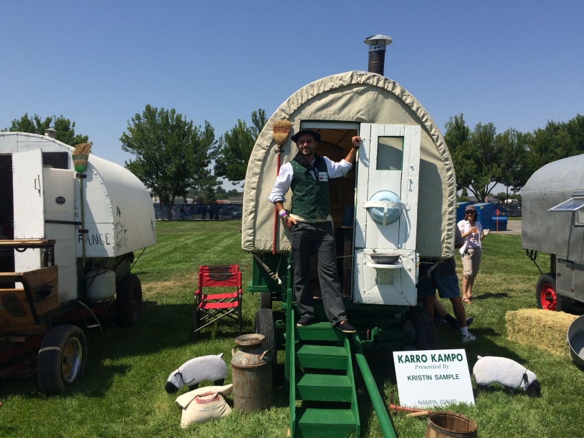 Iñaki Goikoetxea on August 1st at Jaialdi in Boise in front of a sheepwagon, where sheepherders lived (photoEuskalKultura.com)