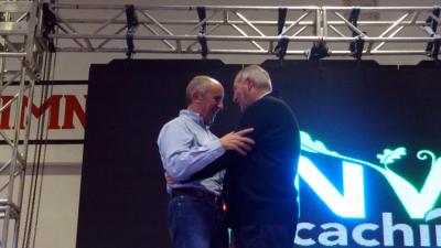 Hug between Josu Erkoreka, Basque Government spokesman and Iñaki Unamuno, president of Euzko Alkartasuna in Macachin after paying tribute with an Aurresku at Semana Nacional Vasca 2015