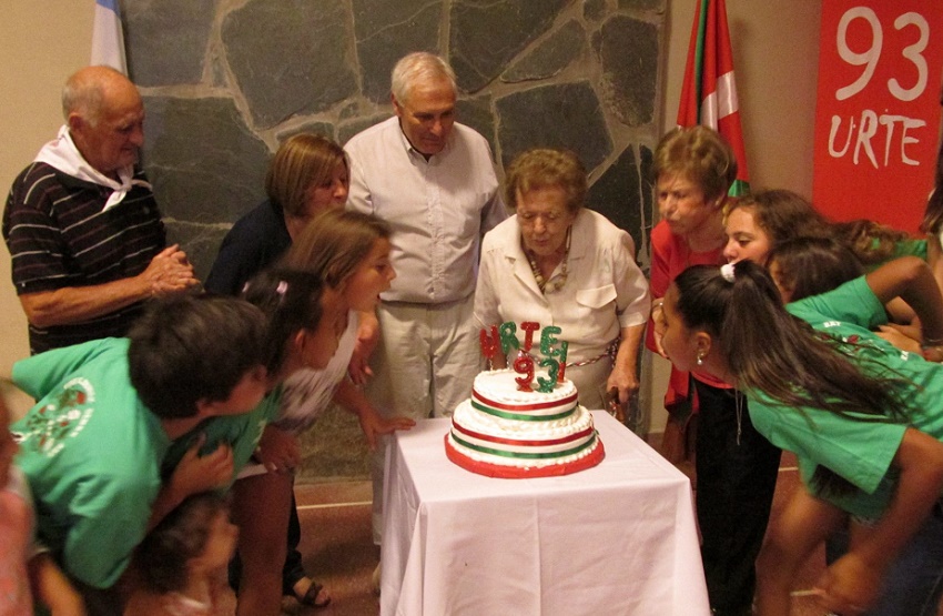 Members of all ages helped blow out the candle for the club’s 93rd birthday (photoEE)