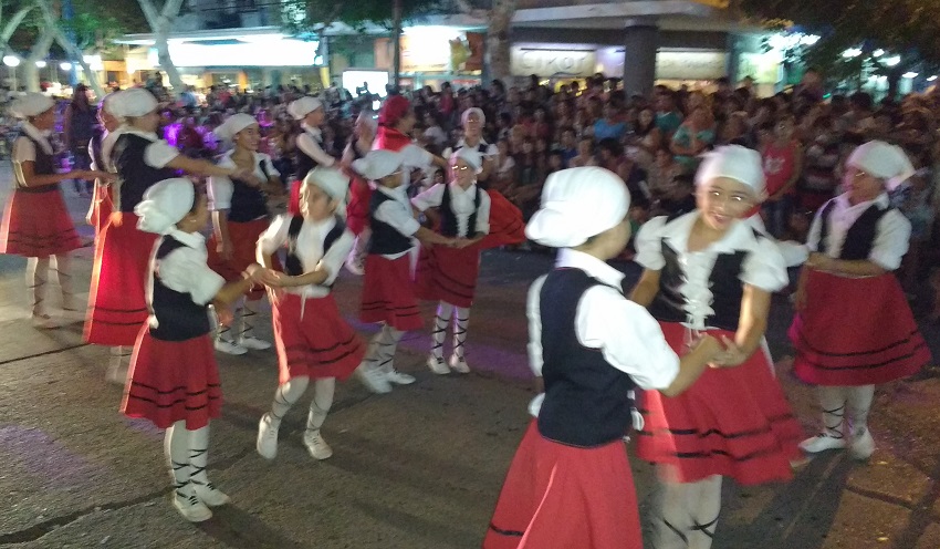 A float accompanied by Basque dancers