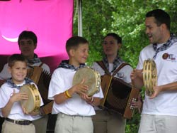 Two Txantxangorriak pandereta players take center stage with their instructor Sean Aucutt (Photos Courtesy Txantxangorriak)