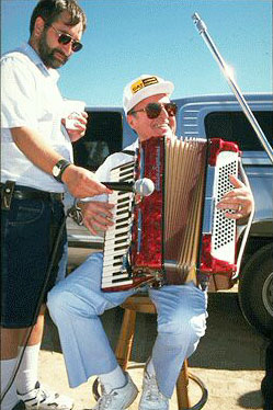 Accordion player Bernardo Yanci assisted by Steve Mendive