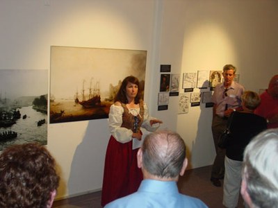 Writer, Christine Echeverria Bender, talking about the history of Basque Whaling at Boise's Basque Museum, dressed in clothing of the period (photo EuskalKultura.com)