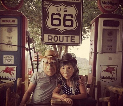 Two of the actors wearing character masks, during a stop on their way to Los Angeles (photo Kulunka Teatro)