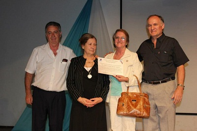 Isabel Beitia posing with the award given her by the city of Obera during the Festival of Immigrants