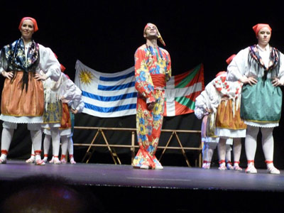 The Ikurriña and Uruguayan flag were both on stage.  In the photo dancing "Zapatain," a dance based on the work of shoemakers 