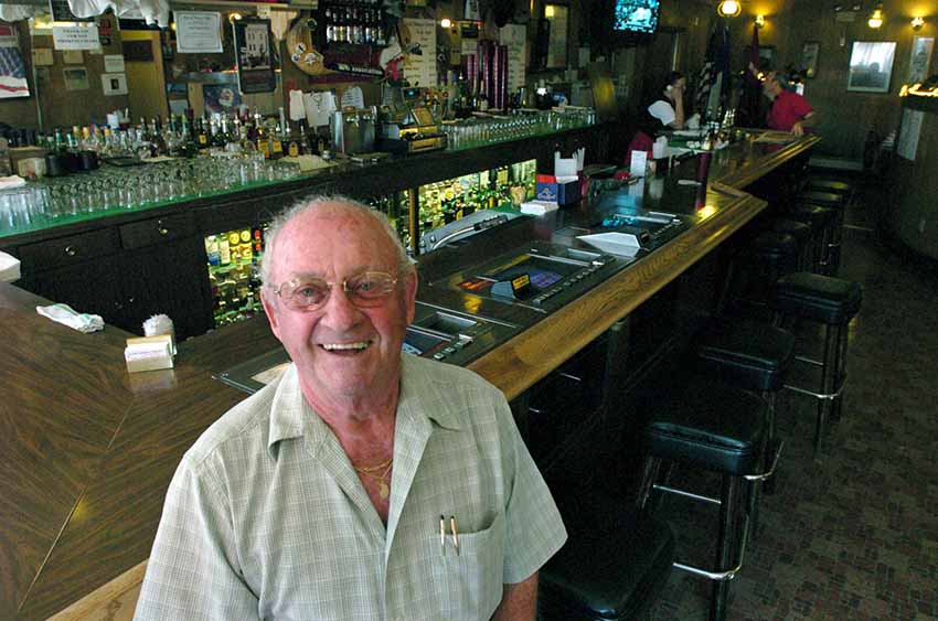 Louis, originally from Maule, in front of the bar at Louis’ Basque Corner (photoRGJ.com) 