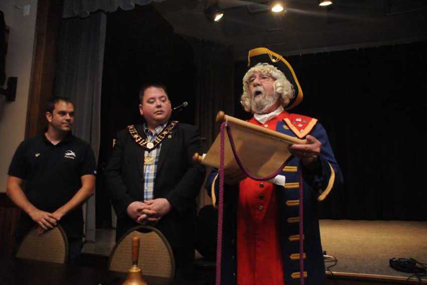 Placentias’ crier last year reading the memorandum of sister-city hood to both mayors (photo Cbncompass.ca)